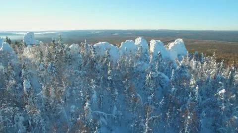 Flying over the snow capped mountains in the horizon 스톡 동영상 61156732