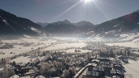 Flying over the snow-covered Austrian village Stock Footage 72165466