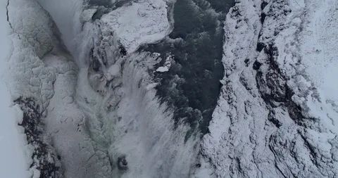 Flying Over Snow Covered Gullfoss Waterfall in the Golden Circle Stock Footage 87537544