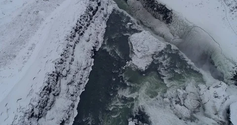 Flying Over Snow Covered Gullfoss Waterfall in the Golden Circle Stock Footage 87540575