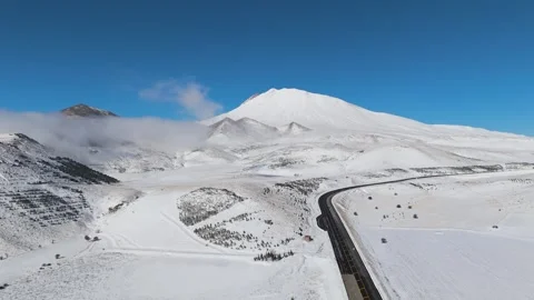 Flying over the snow-covered high mountains Stock Footage 293803203