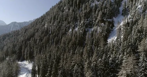 Flying over a snow covered mountain in Switzerland Stock Footage 92547138