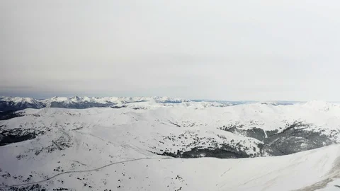 Flying over snow covered mountain after a snow storm. Drone aerial view outside  Video stock 124806258