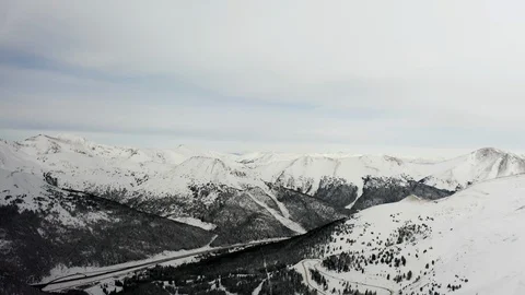 Flying over snow covered mountain after a snow storm. Drone aerial view outside  Video stock 124808847