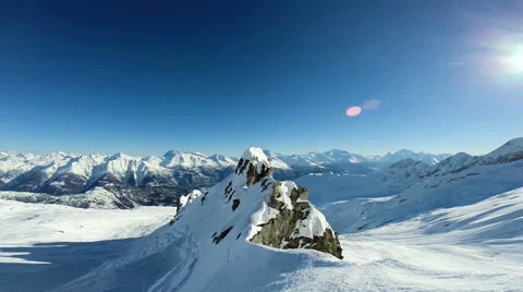 Flying over snow covered mountains. aerial view. winter landscape Stock Footage