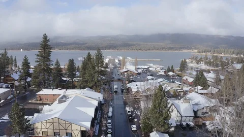 Flying over a Snow covered town with Christmas Lights Stock Footage 120397972