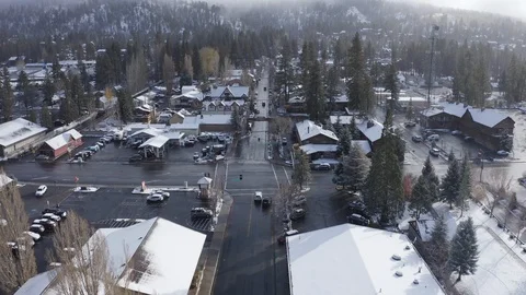 Flying over a Snow covered town with Christmas Lights Stock Footage 120400459