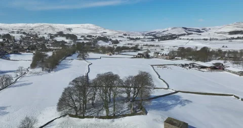Flying over a snow covered valley in Yorkshire Stock-Footage 237830780