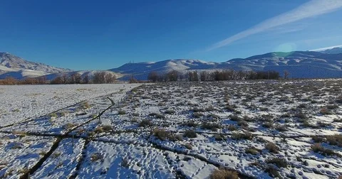 Flying over Snowy fields in california 4k 24fps Stock Footage 72280760