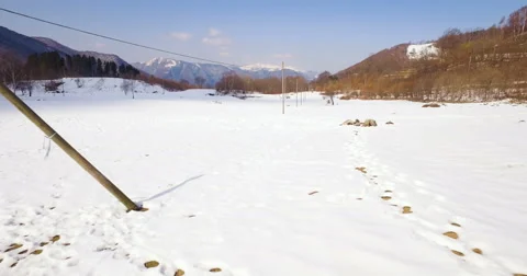 Flying over Snowy Landscape Stock Footage 61269004