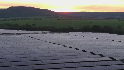 Flying Over Solar Panel Farm in Bulgaria at Sunset Showcasing Solar Panels as Stock Footage 310368595