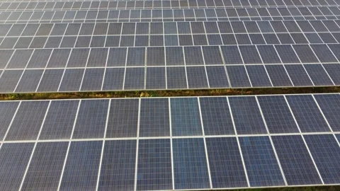 Flying over the solar panels at sunset Video stock 159405743