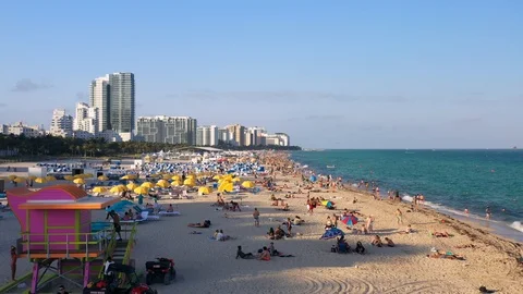 Flying Over South Beach Florida full of People Stock Footage 103328277