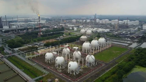 Flying over spherical gas storage tanks, industrial oil refinery Indonesia Asia Stock-Footage 78568677