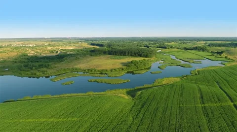 Flying over the spring riverFlying over river, fields and forest 動画素材 40050180