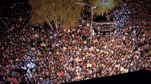 Flying over the stage and spectators at the concert at the city center square. Stock Footage 48436955