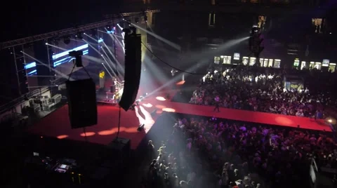Flying over the stage and spectators at the concert. 스톡 동영상 48702292