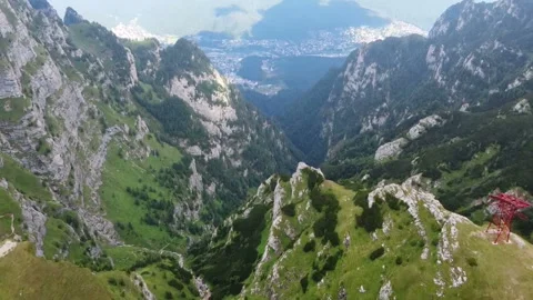 Flying over steep cliffs in the Carpathian mountains , Romania Stock-Footage 137936726