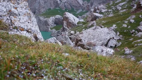Flying over steep hill towards the mountains Stock Footage