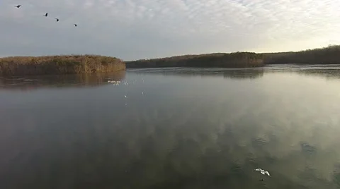 Flying over a Still and Cold Lake Stock Footage 46560557
