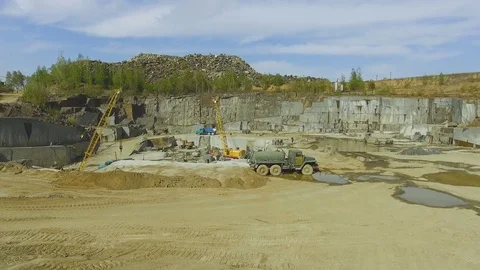 Flying over the stone quarry. Extraction of granite stone. aerial survey Stock-Footage 77592817