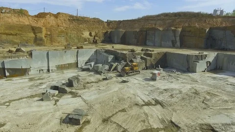 Flying over the stone quarry. Extraction of granite stone. aerial survey Видео 77593408