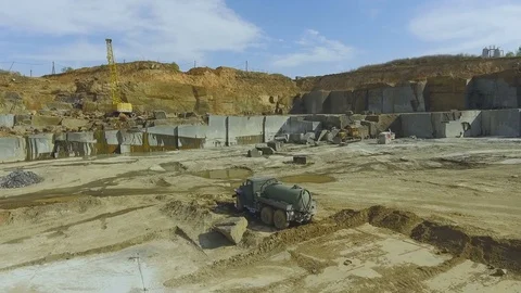 Flying over the stone quarry. Extraction of granite stone. aerial survey Видео 77594332