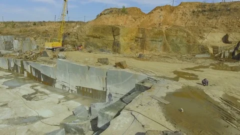 Flying over the stone quarry. Extraction of granite stone. aerial survey Видео 77595375