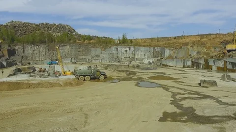 Flying over the stone quarry. Extraction of granite stone. aerial survey Видео 77595722