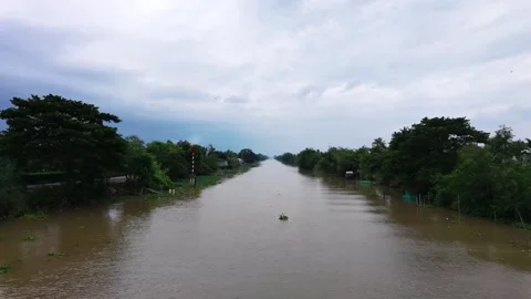 Flying Over a Straight Canal on a Cool Cloudy Afternoon Stock Footage 343606699