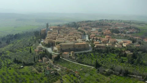 Flying over the streets and squares of a historic town in Tuscany Stock Footage 129382776