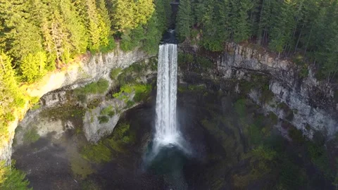 Flying over a stunning waterfall in the wilderness of Canada Stock Footage 200924969