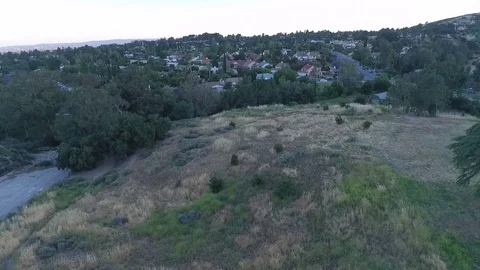 Flying Over Suburbia at Magic Hour Stock Footage 77663055