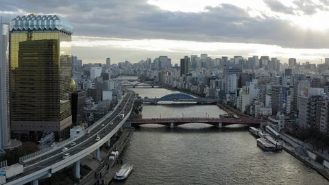 Flying over Sumida River approaching Azuma Bridge in Tokyo, Japan Video stock 103174296