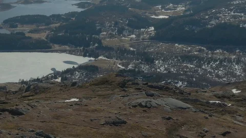 Flying Over the Summit of Justadtinden Tilting to Reveal the Valley In Lofoten Stock Footage 116359828