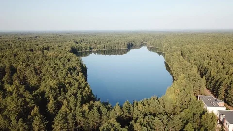 Flying over the sun. Reflection in the lake Streshno Stock Footage 125891387