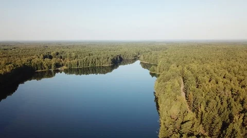Flying over the sun. Reflection in the lake Streshno 動画素材 125891390
