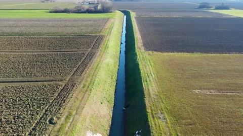 Flying over sunny irrigation water canal Video stock 296481069