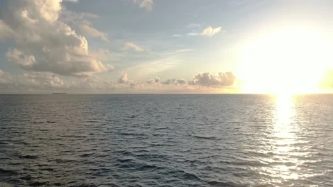 Flying over sunset ocean water 스톡 동영상 195843369