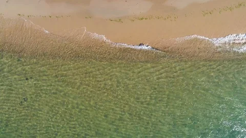 Flying over the surface of the blue water and the shore of lake Baikal Stock Footage 121925022