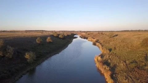 Flying over the surface of a small river Stock Footage 98097206
