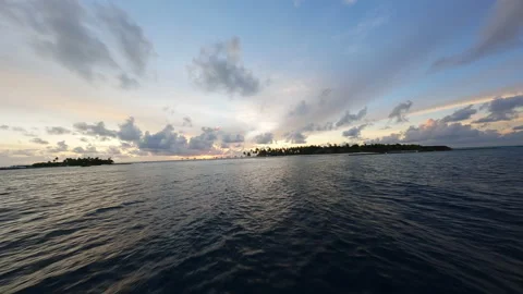 Flying over the surface of the water at sunset. FPV Drone Video. Video stock 238858919