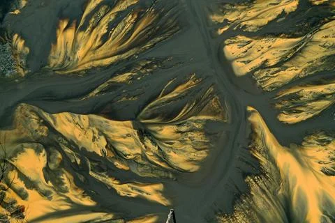 Flying over surreal patterns of flowing colorful mining chemical residuals .. 스톡 사진