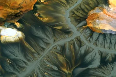 Flying over surreal patterns of flowing colorful mining chemical residuals .. 스톡 사진