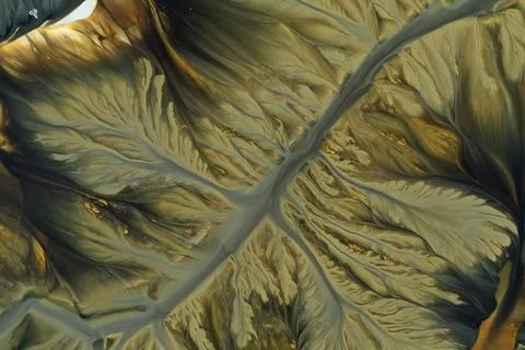 Flying over surreal patterns of flowing colorful mining chemical residuals .. Stock Photos