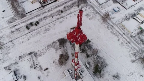Flying over a Telephone Tower with a view of a Russian Village in the Snow. Stock-Footage 174733489