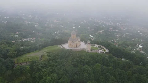 Flying over the Temple of Sameba among light white clouds. Stock Footage 168678402