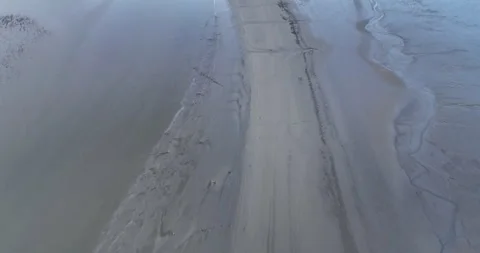 Flying over tidal flats at low tide Stock Footage 247791999