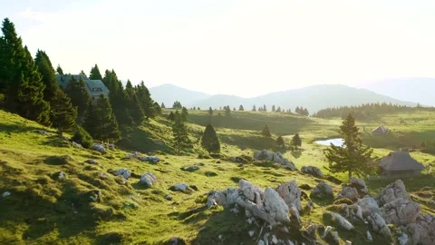 Flying Over Tons Of Huge Rocks on Top of The Mountain, Revealing Wooden Village. Видео 224837982