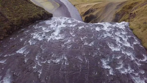 Flying over the top of a large waterfall Stock Footage 91248419
